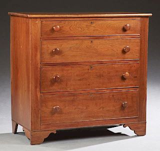 American Carved Walnut Chest, 19th c., the rectangular top over four graduated drawers with wooden knobs, on bracket feet. H.