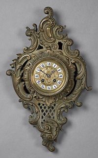 French Bronze Cartel Clock, late 19th c., the scroll decorated body around a drum clock, time and strike, with porcelain chap