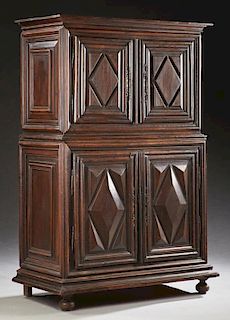 Diminutive French Louis XIII Style Carved Walnut Buffet a Deux Corps, 19th c., the stepped crown over double doors with geome
