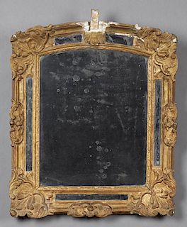 Louis XV Style Gilt and Gessoed Poplar Cushion Mirror, c. 1800, with a leaf and floral decorated frame, now lacking its crest