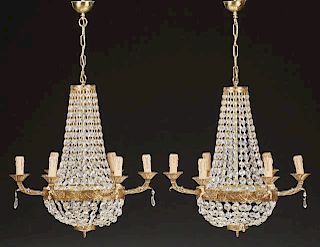 Pair of French Louis XVI Style Brass Six Light Chandeliers, 20th c., the top ring hung with button prism chains joined to a l