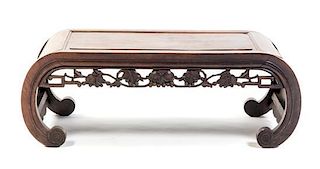 A Chinese Carved Hardwood Low Table, Height 13 1/4 x width 36 x depth 17 1/4 inches.