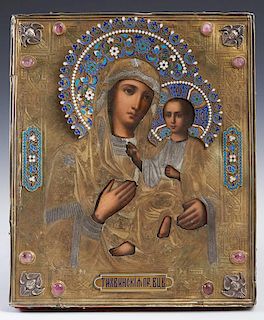 Russian Icon of the Virgin of Tikhvin, Moscow, 1886, with an enameled gilt silver oklad mounted with oval cabochon stones, wi