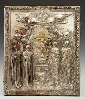 Russian Icon of the Crucifixion, late 19th c., the cross flanked by saints and angels, with a silverplated riza, H.- 12 in.,