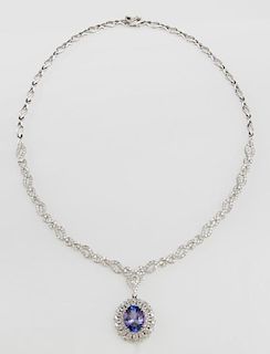 14K White Gold Tanzanite Necklace, with 18 flat twisted links joined to 12 diamond mounted links joined by 11 diamond mounted