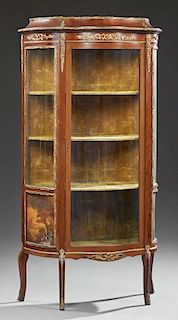 Louis XV Style Ormolu Mounted Carved Mahogany Bowfront Vitrine, early 20th c., the stepped top over a central curved glass do