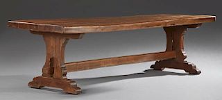 French Provincial Carved Oak Farmhouse Table, 19th c., the thick three plank top on trestle supports joined by a thick stretc