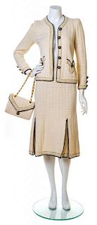 An Adolfo Cream, Gold and Navy Knit Skirt Ensemble, No size. Handbag: 8.5'' x 6''; Strap drop: 10.5''.