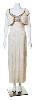 A Mary McFadden Cream Silk Pleated Gown with Bolero, Dress size 4.