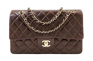 A Chanel Dark Brown Lambskin Quilted Medium Double Flap Bag, 9.75" x 6.25" x 3"; Strap drop: 9.25".