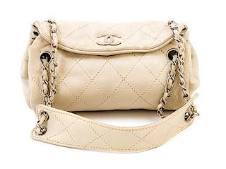 A Chanel Cream Lambskin Quilted Shoulder Bag, 9.5" x 7" x 5.5"; Strap drop: 10".