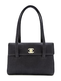 A Chanel Black Satin Small Flap Handbag, 7.5" x 5.5" x 1.75"; Handle drop: 5.5".