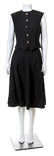 A Pauline Trigere Black Sleeveless Vest and Skirt Set, No size.