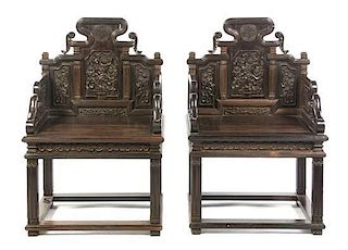 A Pair of Chinese Carved Zitan Wood Armchairs, Height 41 1/4 x width 26 1/2 x depth 17 1/2 inches.