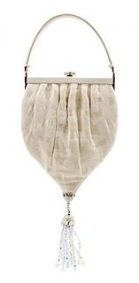 A Judith Leiber Cream Silk Textured Handbag, 5.5" x 10" x 1"; Handle drop: 3".