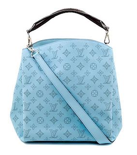 A Louis Vuitton Blue Selene Cross Body Satchel, 11" x 12" x 7"; Handle drop: 4"; Strap drop: 18".