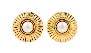A Pair of Chanel Goldtone Earclips, 1.25" circumference.