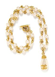A Chanel Goldtone and Pearl Necklace, 38" length.