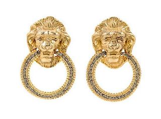 A Pair of Goldtone Lion Earclips, 2" x 1.25".