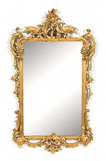 A Pair of Louis XV Style Carved Giltwood Mirrors Height 48 x width 28 1/2 inches.