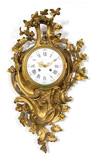 A Louis XV Style Gilt Bronze Cartel Clock Height 25 x width 14 x depth 5 inches.
