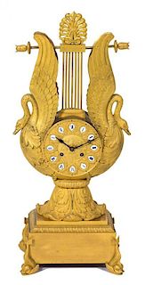 A French Empire Gilt Bronze Lyre-Form Clock Height 22 1/4 inches.
