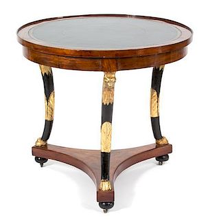 A French Empire Walnut, Ebonized and Gilt Circular Game Table Height 30 x diameter 37 inches.