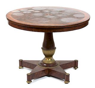 A French Empire Burl Inlaid Mahogany Center Table Height 28 1/2 x diameter 37 3/4 inches.