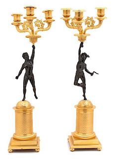 A Pair of French Empire Bronze and Gilt Bronze Three-Light Candelabra Height 21 inches.