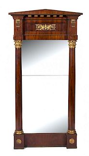 A French Empire Style Gilt Metal Mounted Mahogany Pier Mirror Height 59 x width 30 1/4 inches.