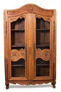 A Louis XV Style Carved Oak Armoire Height 90 x width 55 x depth 17 inches.