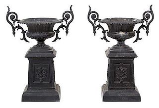 A Pair of Black Painted Victorian Style Cast Metal Planters Height 40 x width 27 1/2 inches.