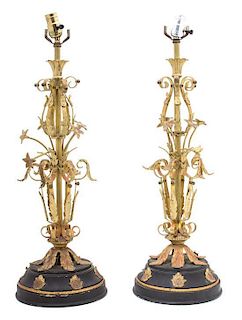 A Pair of Brass and Patinated Metal Lamps Height 24 inches.