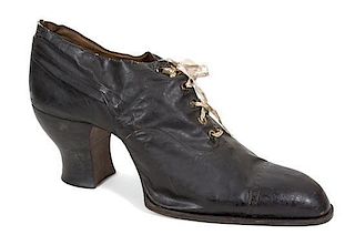 An English Leather Advertising Model of a Black Shoe Height 21 x length 41 inches.