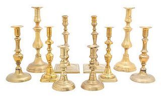 Five Pairs of English Brass Candlesticks Height of tallest 12 inches.