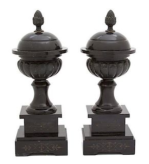 A Pair of English Black Marble and Iron Covered Urns on Pedestal Bases Height 10 1/2 inches.