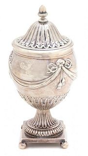 An English Victorian Silver Covered Urn, London, 1852, having an ovoid bowl with bow-tied swag and tassel decoration, on a pe