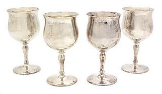 A Set of Four American Silver Goblets, Reed & Barton, Taunton, MA, each with serpentine shaped bowl, plain stem and circular 