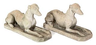 A Pair of Cast Stone Recumbent Greyhounds Height 16 1/2 x length 27 1/2 inches.
