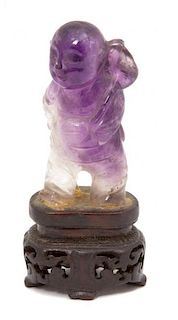 A Chinese Amethyst Carving of a Boy Holding a Palm Leaf Height 2 inches.