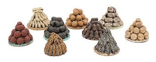 Nine Chinese Tromp-l'Oeil Glazed Ceramic Stacks of Nuts Height of tallest 3 inches.