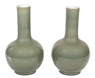 A Pair of Chinese Celadon Glazed Porcelain Vases Height 29 1/2 inches.