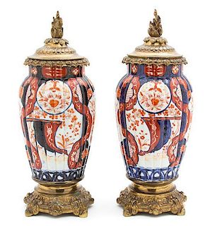 A Pair Asian Export Imari Painted Porcelain and Gilt-bronze Mounted Mantel Urns Height 16 1/2 inches.