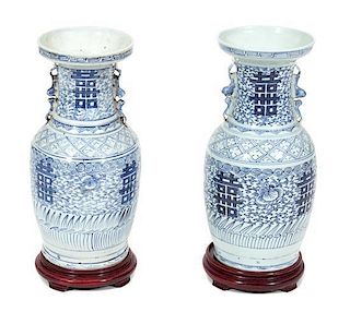 A Pair of Chinese Blue and White Porcelain Vases Height of porcelain 17 inches.