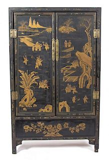A Chinese Black and Gilt Lacquer Two-Door Cabinet