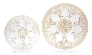 Rene Lalique, (French, 1860-1945), Vases design, comprising of one serving plate and twelve side plates, molded and frosted g