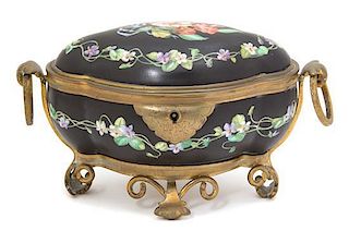 A Continental Gilt Metal Mounted Porcelain Oval Box Length 7 3/4 inches.