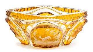 A Bohemian Etched Amber Overlay Glass Oval Bowl Height 4 1/2 x length 10 inches.