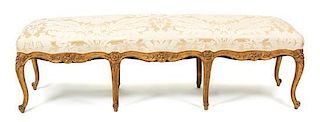 A Louis XV Style Giltwood Long Bench Height 17 x length 65 inches.
