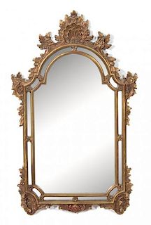 A Louis XV Style Giltwood Mirror Height 52 x width 29 inches.